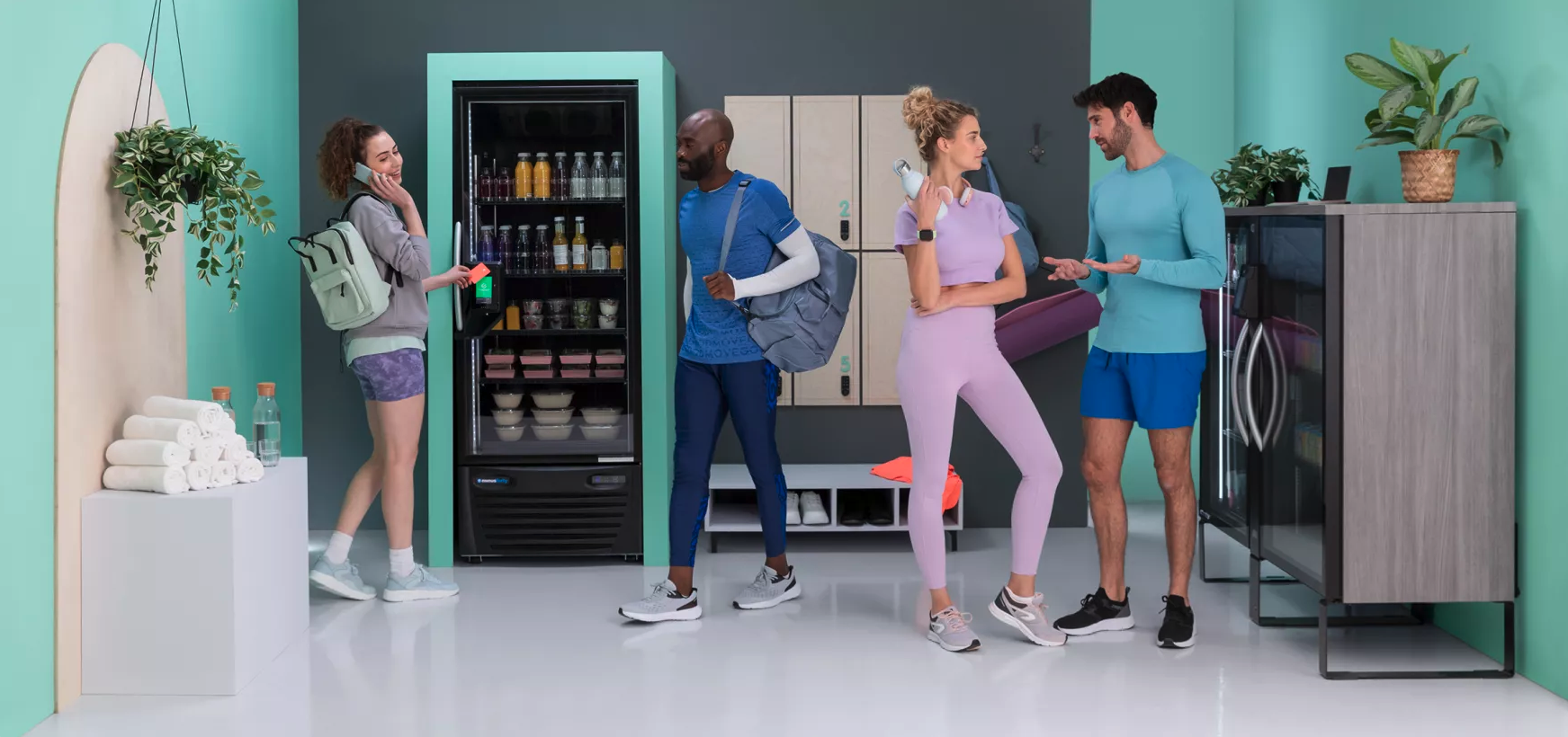 Refrigerated Cooler in a gym breakroom with people